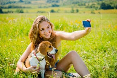 Woman Taking Selfie with Dog